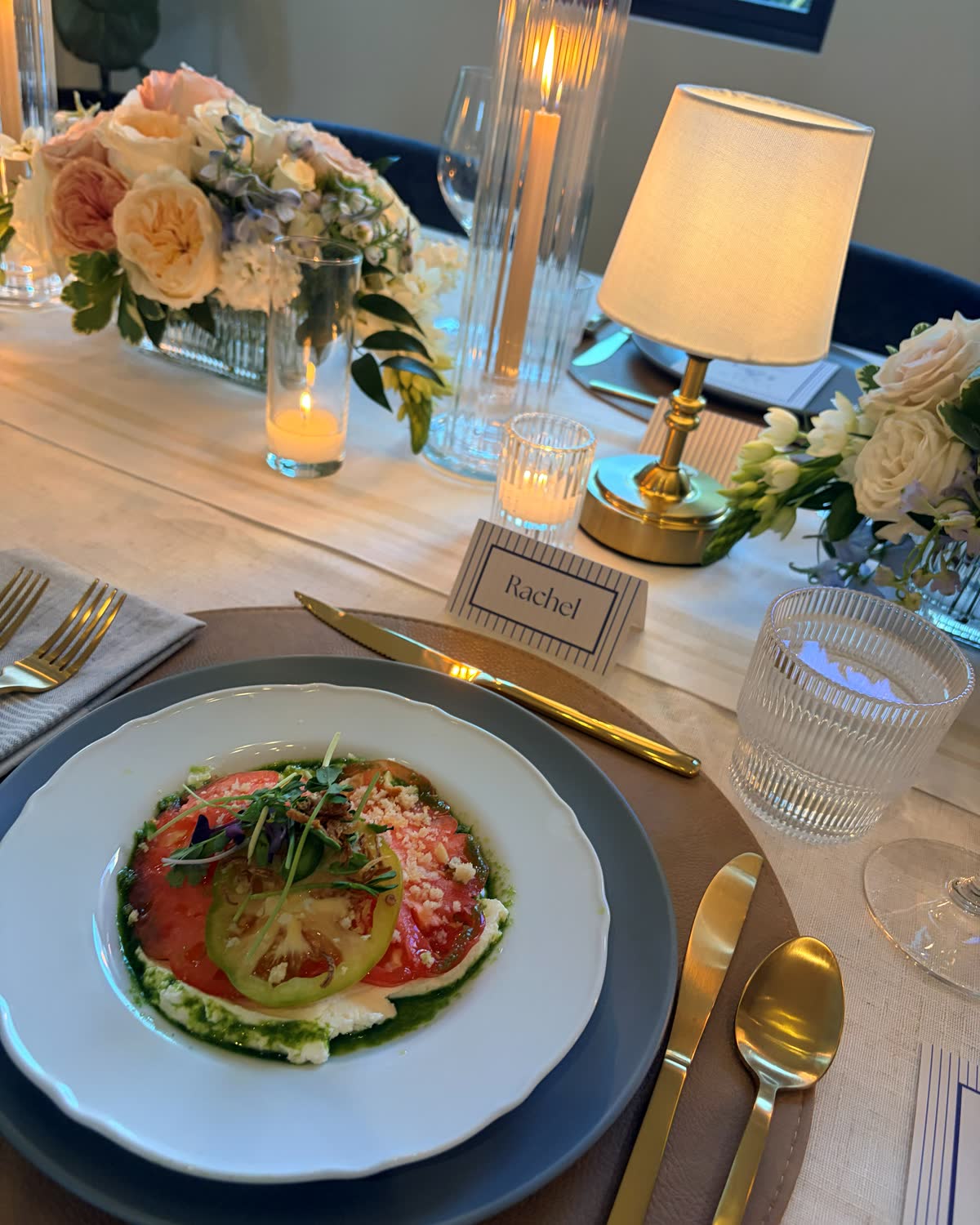 An intimate dinner place setting with a plated first course
