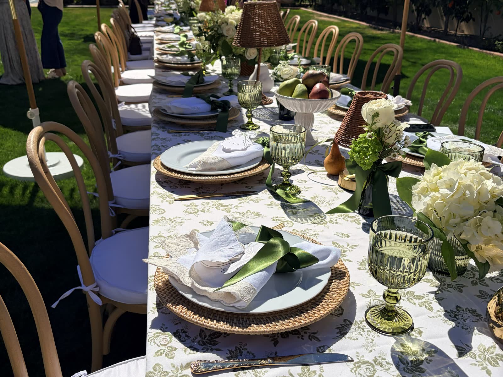 A long garden table set for a private event