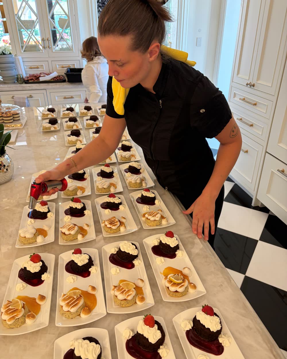 A Nutrition Intuition chef plating dishes in a client kitchen