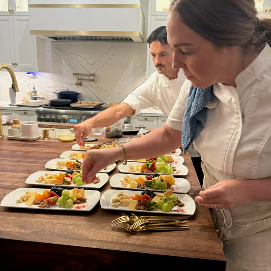 Nutrition Intuition chefs plating dinner in a client kitchen
