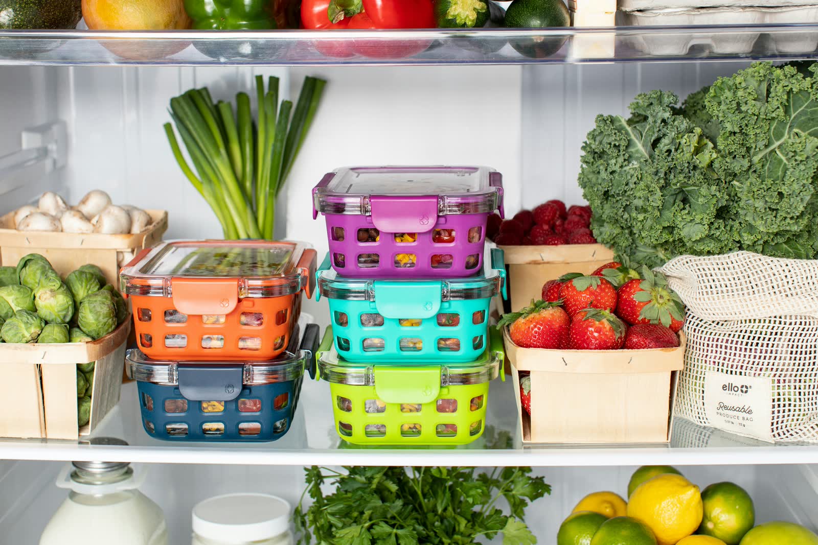 A refrigerator stocked with a week of prepared meals in glass containers